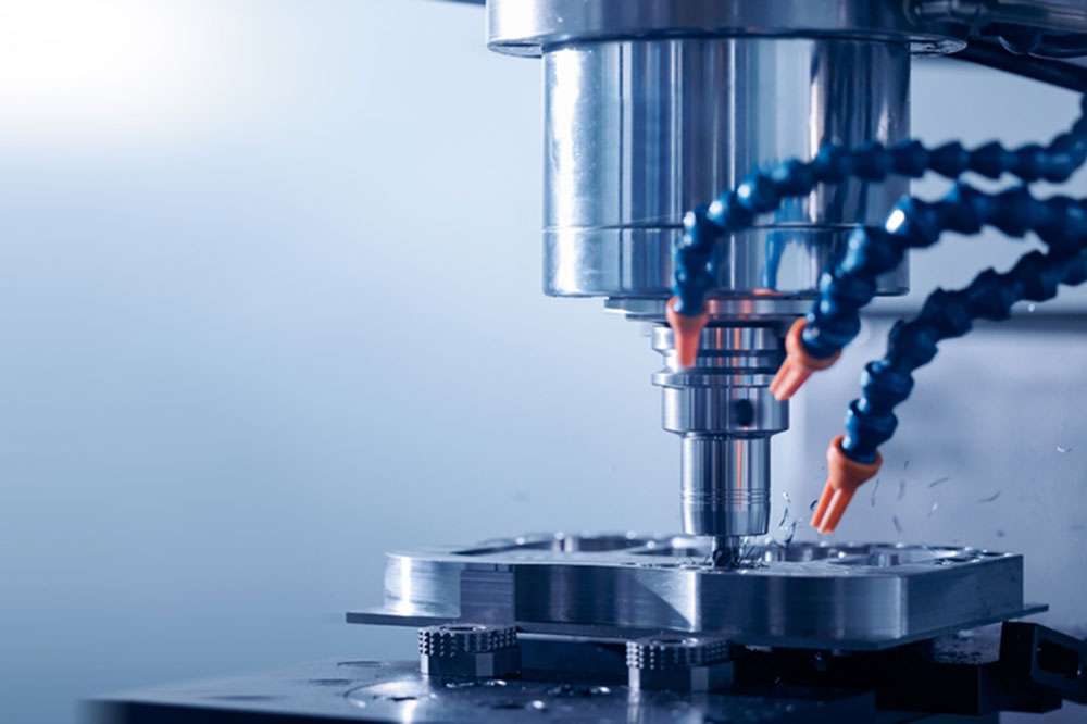 Closeup CNC milling machine during operation. Produced cutting metal parts, banner background of industry heavy factory.